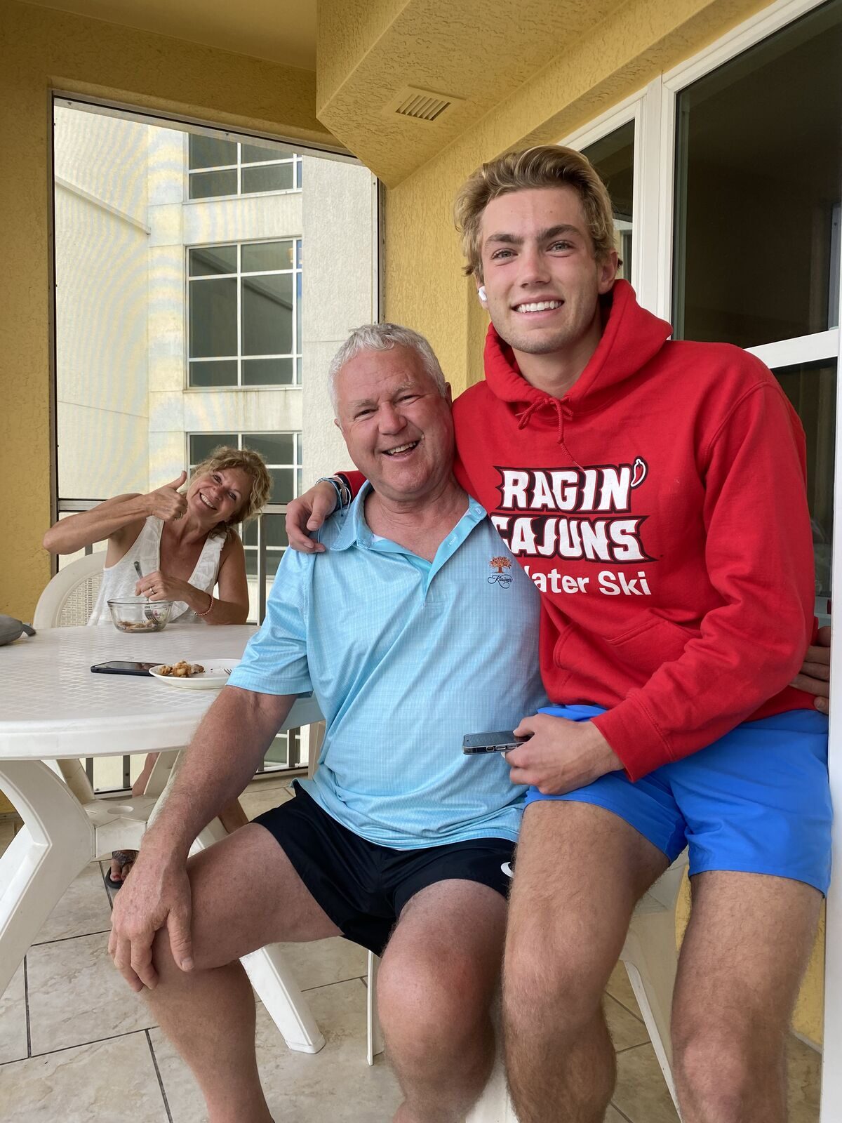 Ken Nelson and grandson Sean Kraus laughing together off the water